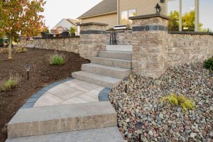 paver and stamped concrete edge walkway and stairs with pillars