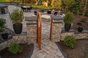 Pittsford, NY Coventry Ridge retaining walls, Pillars and a wooden door with a circular window