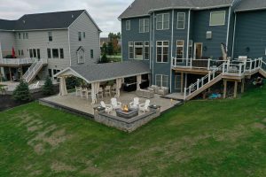 Custom built fire pit and a new modern patio with retaining walls in Brighton, NY